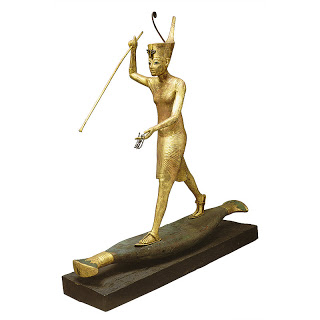Gilded statue of Tutankhamun hunting on a papyrus skiff
